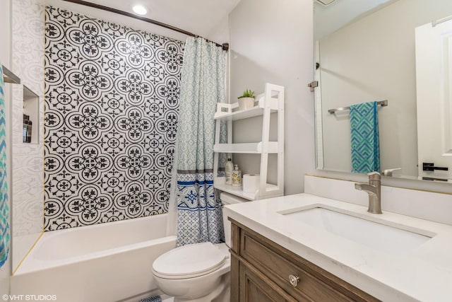 full bathroom with vanity, toilet, and shower / tub combo