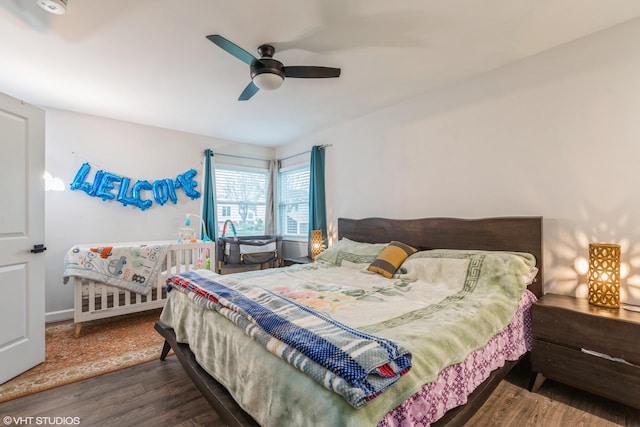 bedroom featuring dark wood-type flooring and ceiling fan