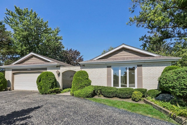 single story home featuring a garage