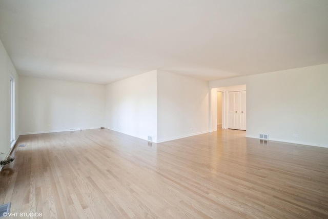 unfurnished room with light hardwood / wood-style flooring