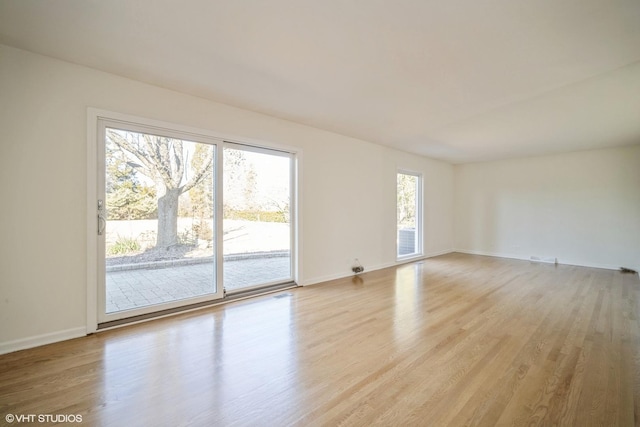 unfurnished living room featuring light hardwood / wood-style floors