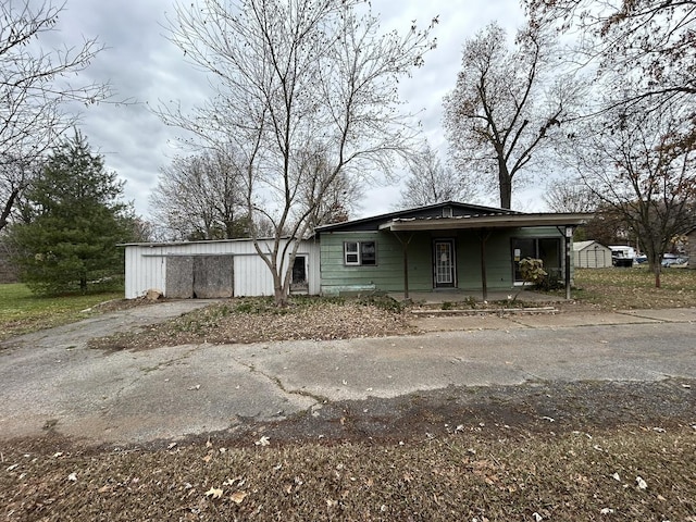 313 E 7th St, Brookport, IL 60534 - view of front of house featuring asphalt driveway and a porch