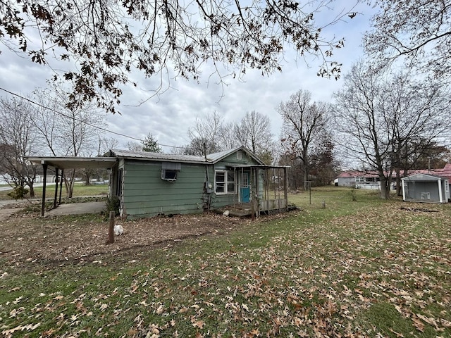 313 E 7th St, Brookport, IL 60534 - view of home's exterior with a yard and a wall unit AC
