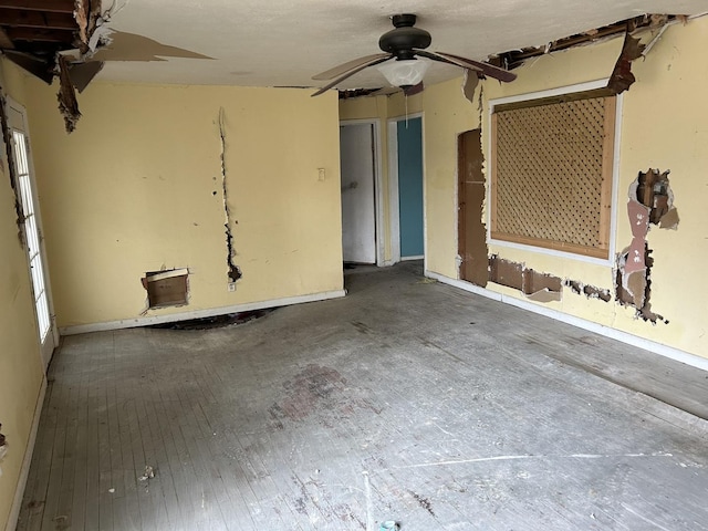 313 E 7th St, Brookport, IL 60534 - unfurnished living room featuring ceiling fan and hardwood / wood-style floors