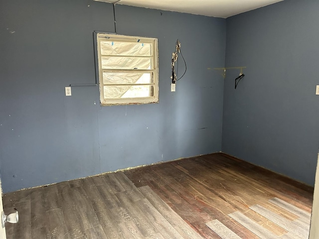 unfurnished room with hardwood / wood-style flooring