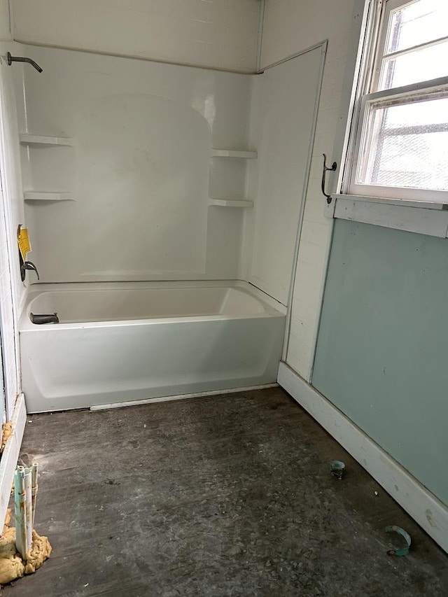 bathroom featuring washtub / shower combination