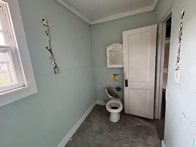 313 E 7th St, Brookport, IL 60534 - bathroom featuring unfinished concrete flooring, healthy amount of natural light, and ornamental molding