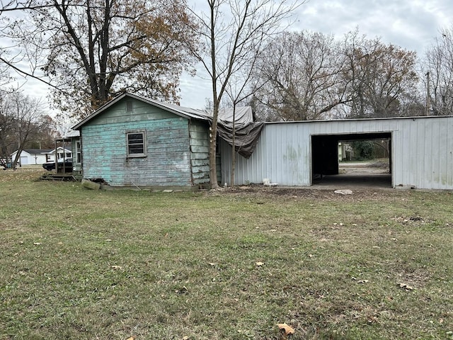 exterior space with a lawn and an outdoor structure