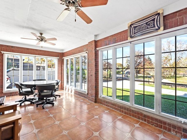 sunroom with ceiling fan and a wealth of natural light