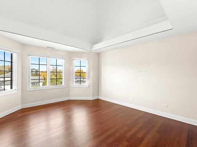 spare room featuring dark hardwood / wood-style floors