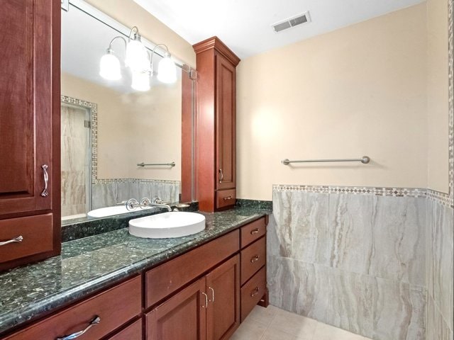 bathroom featuring tile patterned floors and vanity