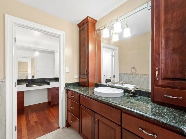 bathroom with vanity and hardwood / wood-style flooring