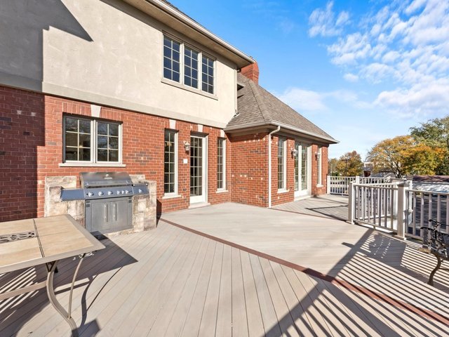 wooden deck featuring grilling area