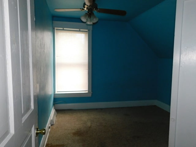 bonus room featuring carpet floors, ceiling fan, and lofted ceiling