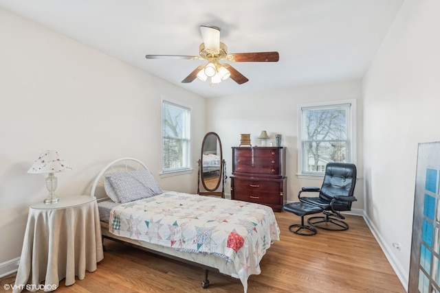 bedroom featuring ceiling fan and light wood-type flooring