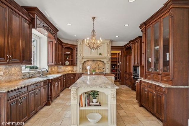 kitchen with a sink, open shelves, stainless steel microwave, and stone tile flooring