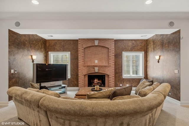 carpeted living room with recessed lighting, baseboards, and a fireplace