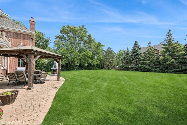 view of yard with a gazebo and a patio