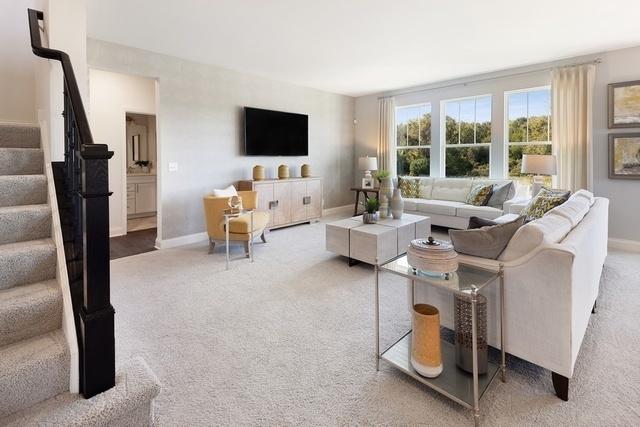 378 W Point Cir, Algonquin, IL 60102 - living area featuring carpet, baseboards, and stairs