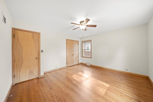 unfurnished room featuring light hardwood / wood-style floors and ceiling fan