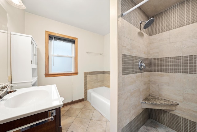 full bathroom featuring tile patterned floors, separate shower and tub, vanity, and toilet