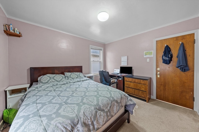 carpeted bedroom featuring crown molding