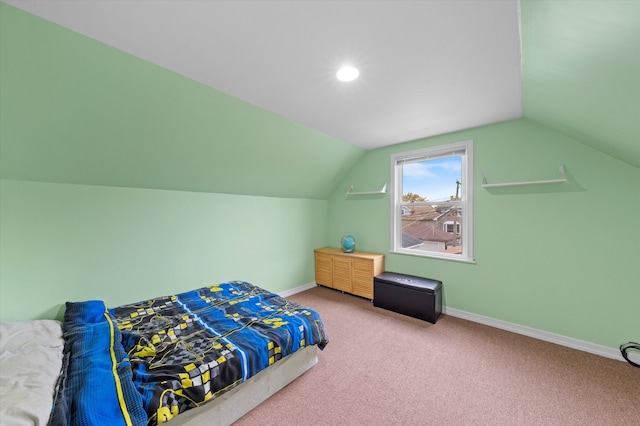 bedroom with carpet and vaulted ceiling