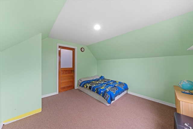 carpeted bedroom with vaulted ceiling