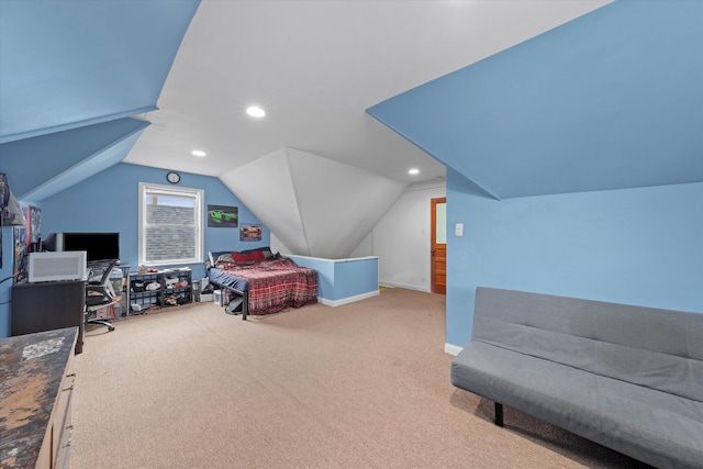 bedroom featuring light colored carpet and vaulted ceiling