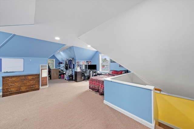 carpeted bedroom featuring lofted ceiling