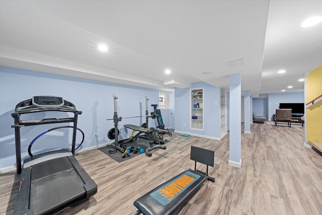 exercise area featuring light hardwood / wood-style flooring