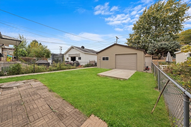 exterior space featuring an outbuilding, a front lawn, and a garage