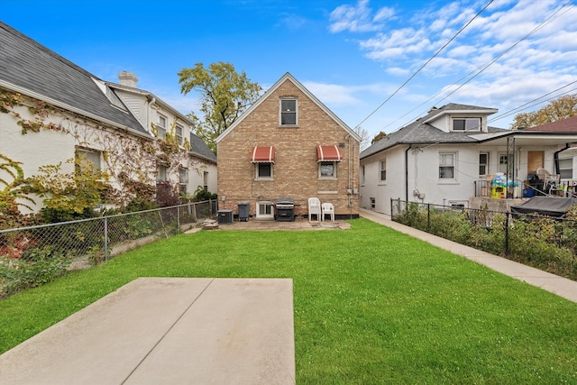 back of house featuring a yard