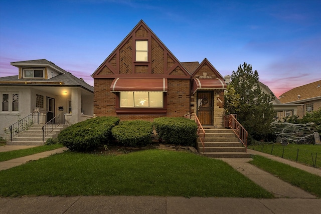 view of front of property with a yard