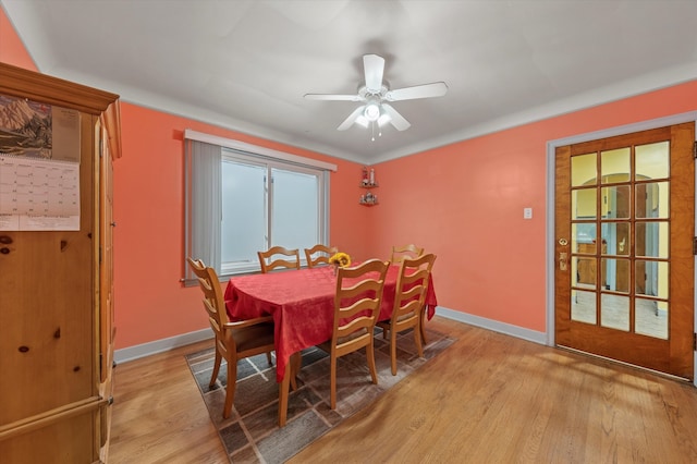 dining space featuring ceiling fan and light hardwood / wood-style flooring