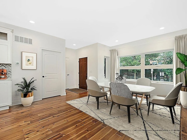 dining area with wood-type flooring