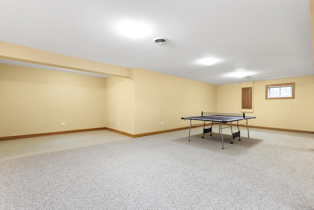 rec room with light colored carpet