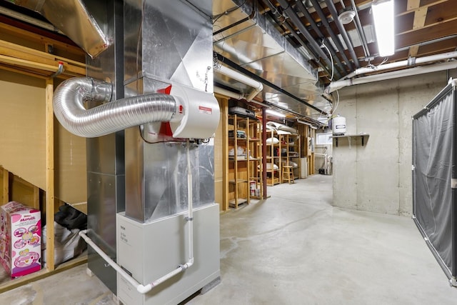 utility room featuring heating unit