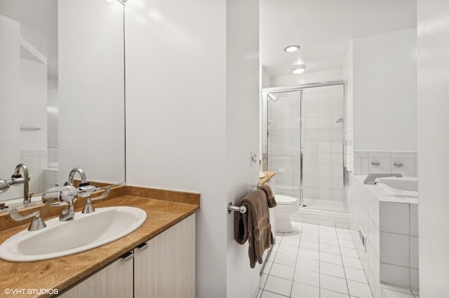 full bathroom with separate shower and tub, tile patterned flooring, vanity, and toilet