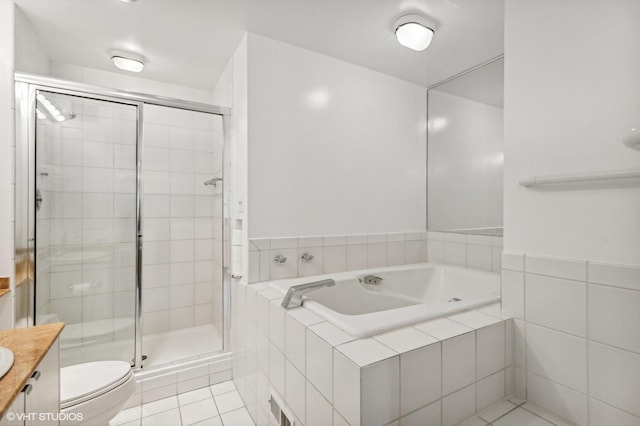 full bathroom with tile patterned floors, vanity, shower with separate bathtub, and toilet