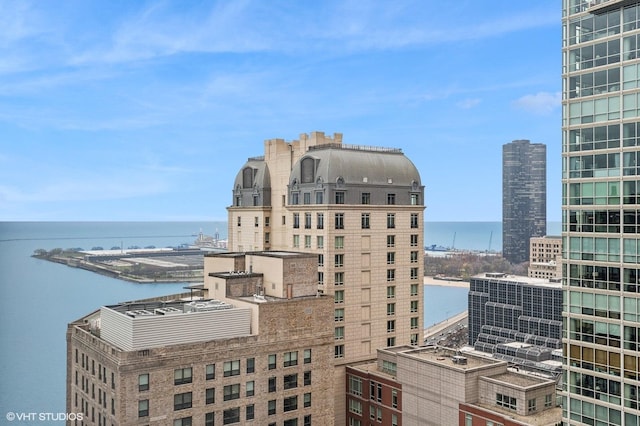 property's view of city with a water view