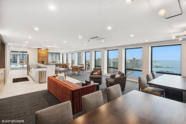 dining space with a water view and a wealth of natural light