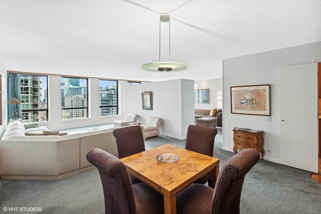 dining area featuring light carpet