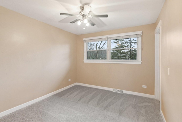 carpeted empty room with ceiling fan