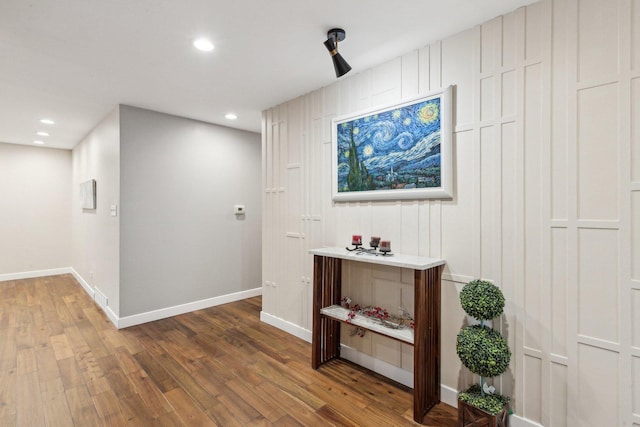 hallway with wood-type flooring