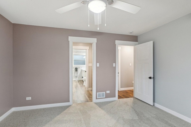 bedroom featuring light colored carpet and ceiling fan