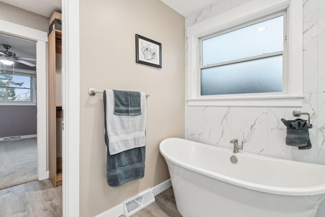 bathroom featuring a bathtub and wood-type flooring