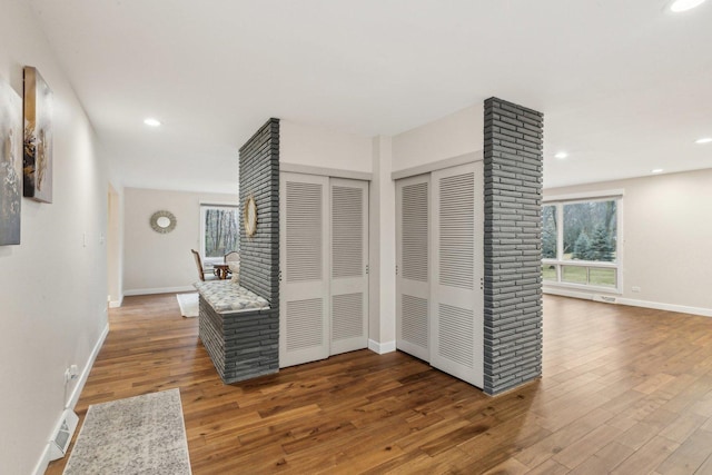 corridor featuring hardwood / wood-style floors