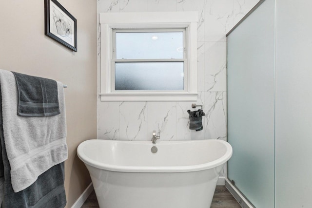 bathroom featuring separate shower and tub