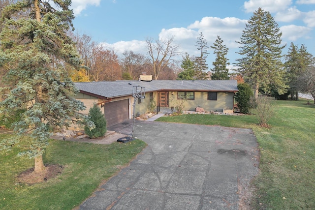 single story home with a garage and a front yard